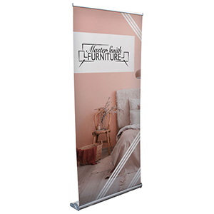Trade show retractable banner stand with graphic banner.