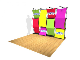 Xpressions stretch fabric trade show display pop-up with attached graphics on frame.