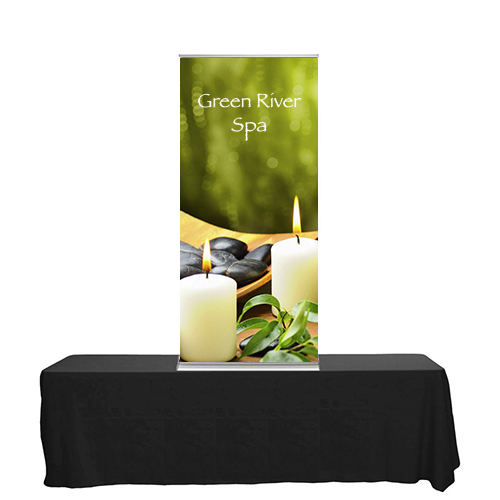 Blade Lite 36 inch retractable banner stand sitting on a tabletop.