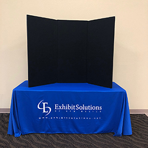 Folding panel trade show tabletop display with black velcro compatible fabric.