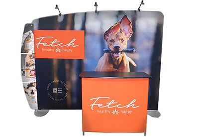 Featherlite Medallion trade show display with stretch fabric, aluminum tube frame and lights.