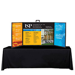 Voyager Mini folding tabletop display with a black table cover